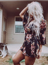 Floral romper with knot tie