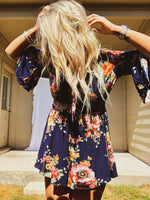 Floral romper with knot tie